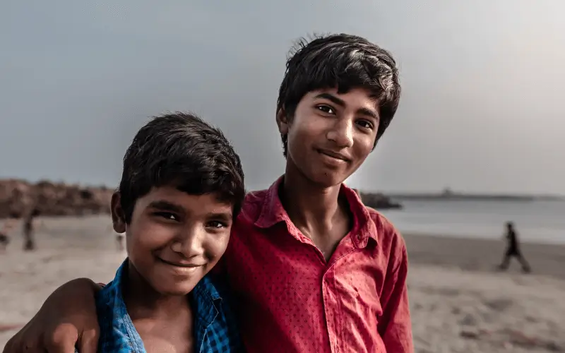 kids playing in the beach in India