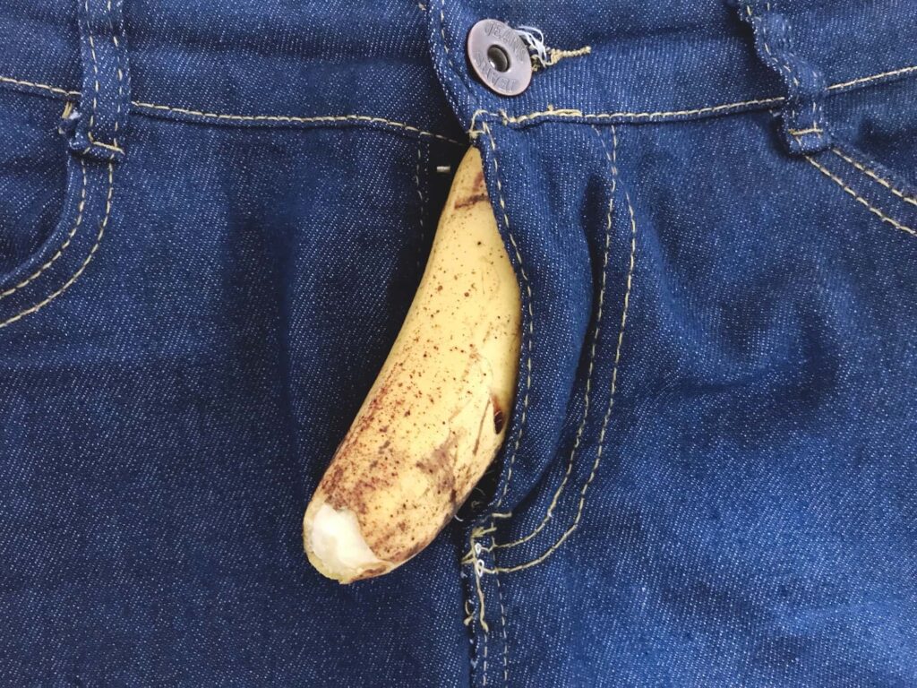 peeled banana inside jeans resembling peeled skin on penis